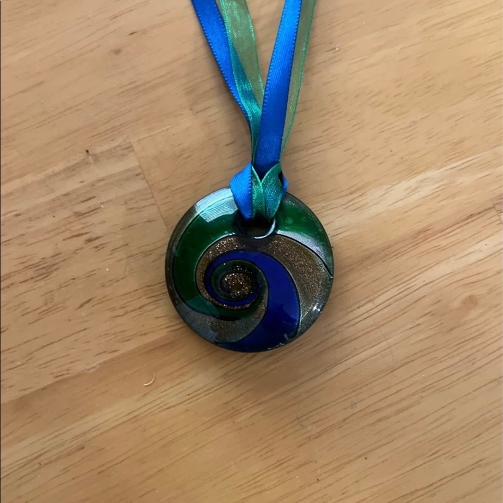 Unusual pendant on ribbon